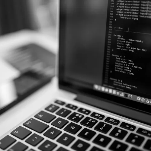 Photo showing code on the screen of a laptop